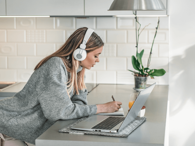 Woman learning time management techniques online from home